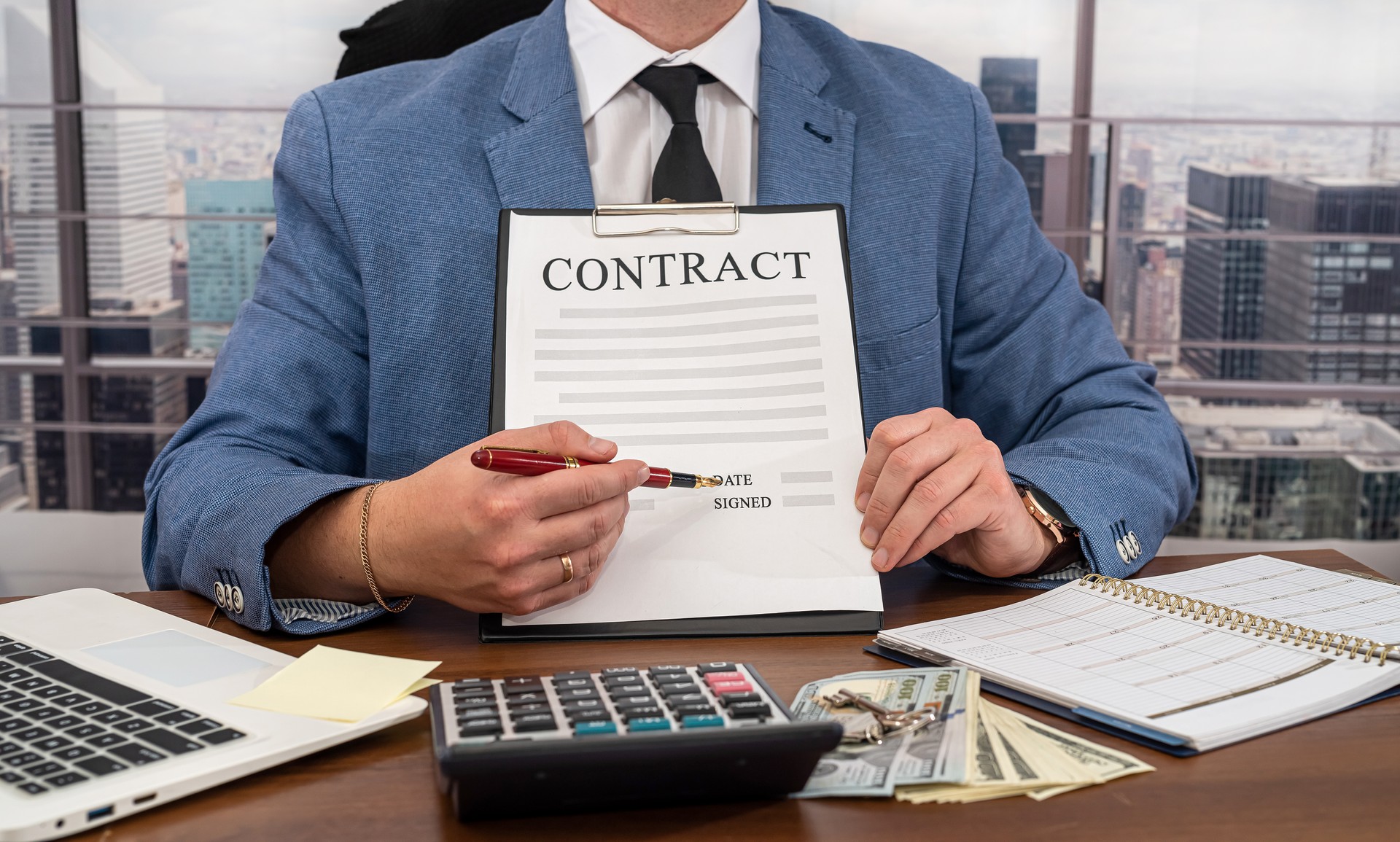 man in expensive clothes with dollars in his hands signed a wonderful contract and he was paid